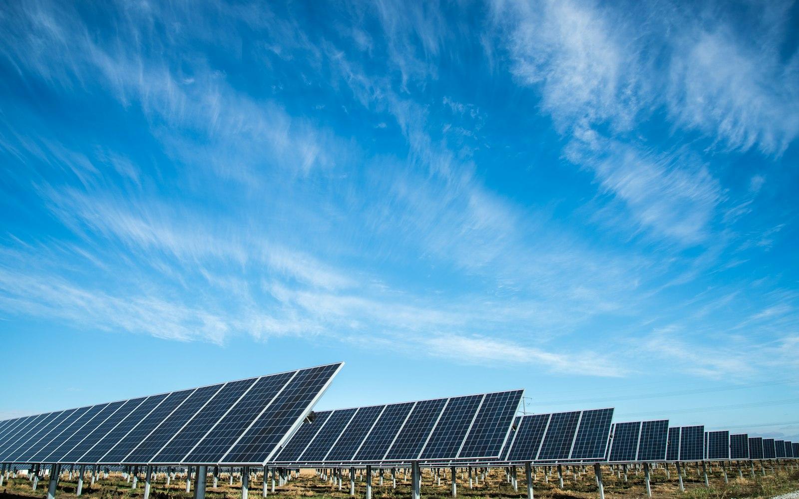 Solar panels under a clear blue sky